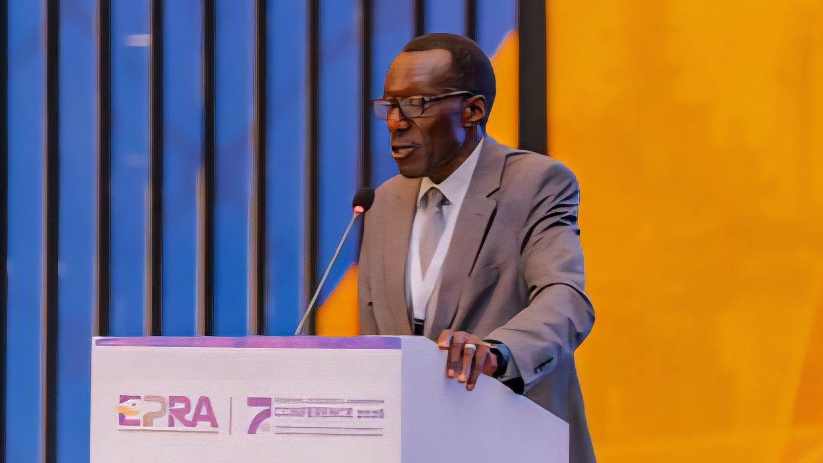 EPRA Acting Director General Joseph Oketch speaking at a podium during the 7th Regional Research and Innovation Conference in Nairobi.