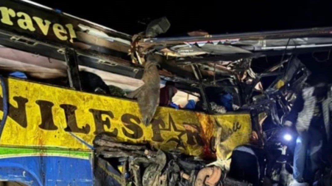 Rescue efforts underway at the scene of the bus collision on the Kampala-Gulu highway.