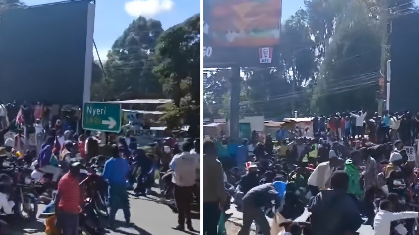 Crowds of residents protesting on the streets of Nanyuki town against the proposed Ebola quarantine facility, seen next to a Nyeri highway road sign in Laikipia County as captured in file 232908.png.