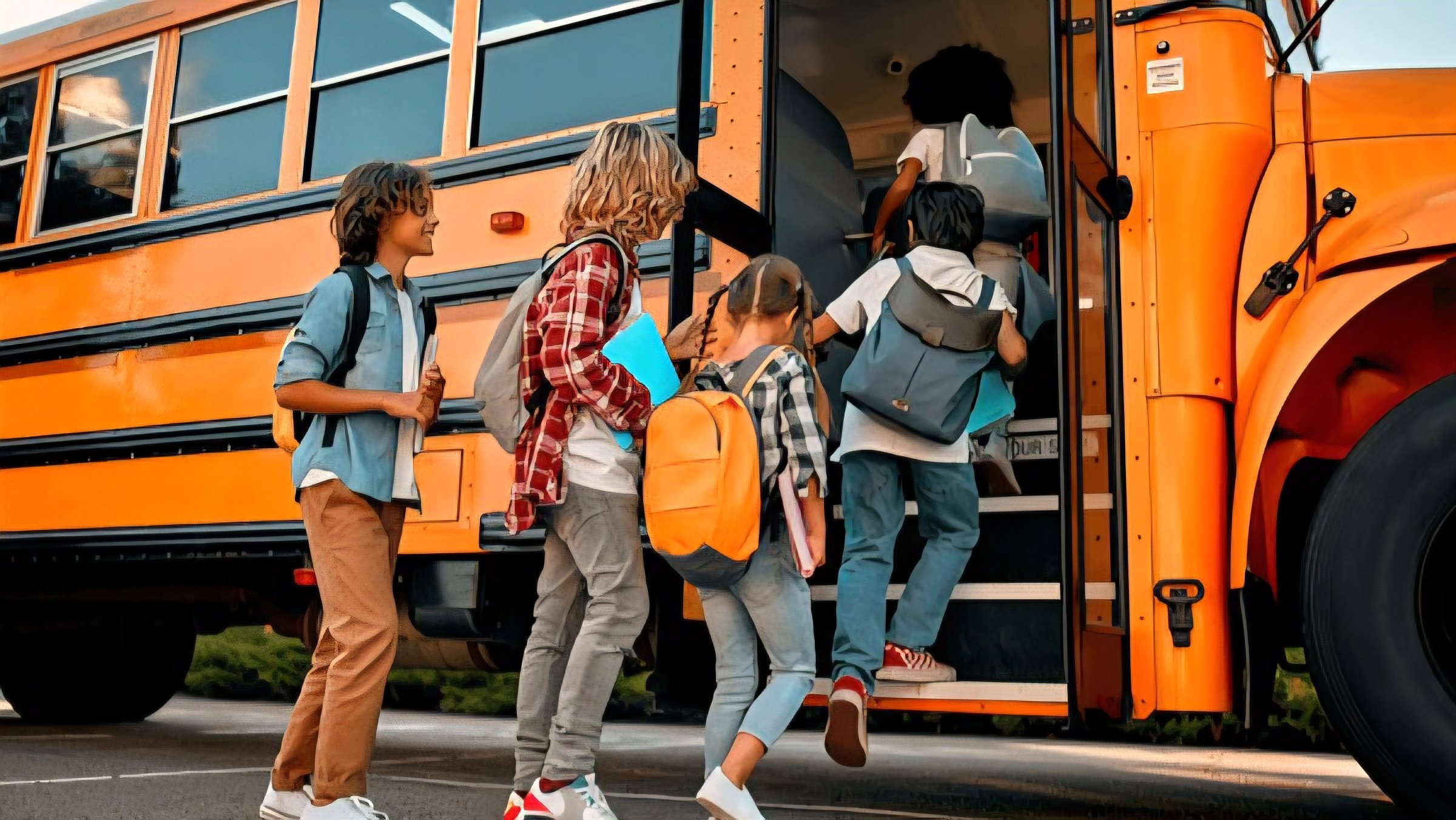 Yellow school buses lined up in a row during a morning traffic jam on a busy Kenyan highway.