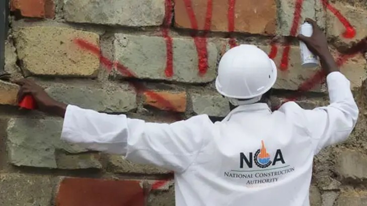 NCA official marks a condemned building