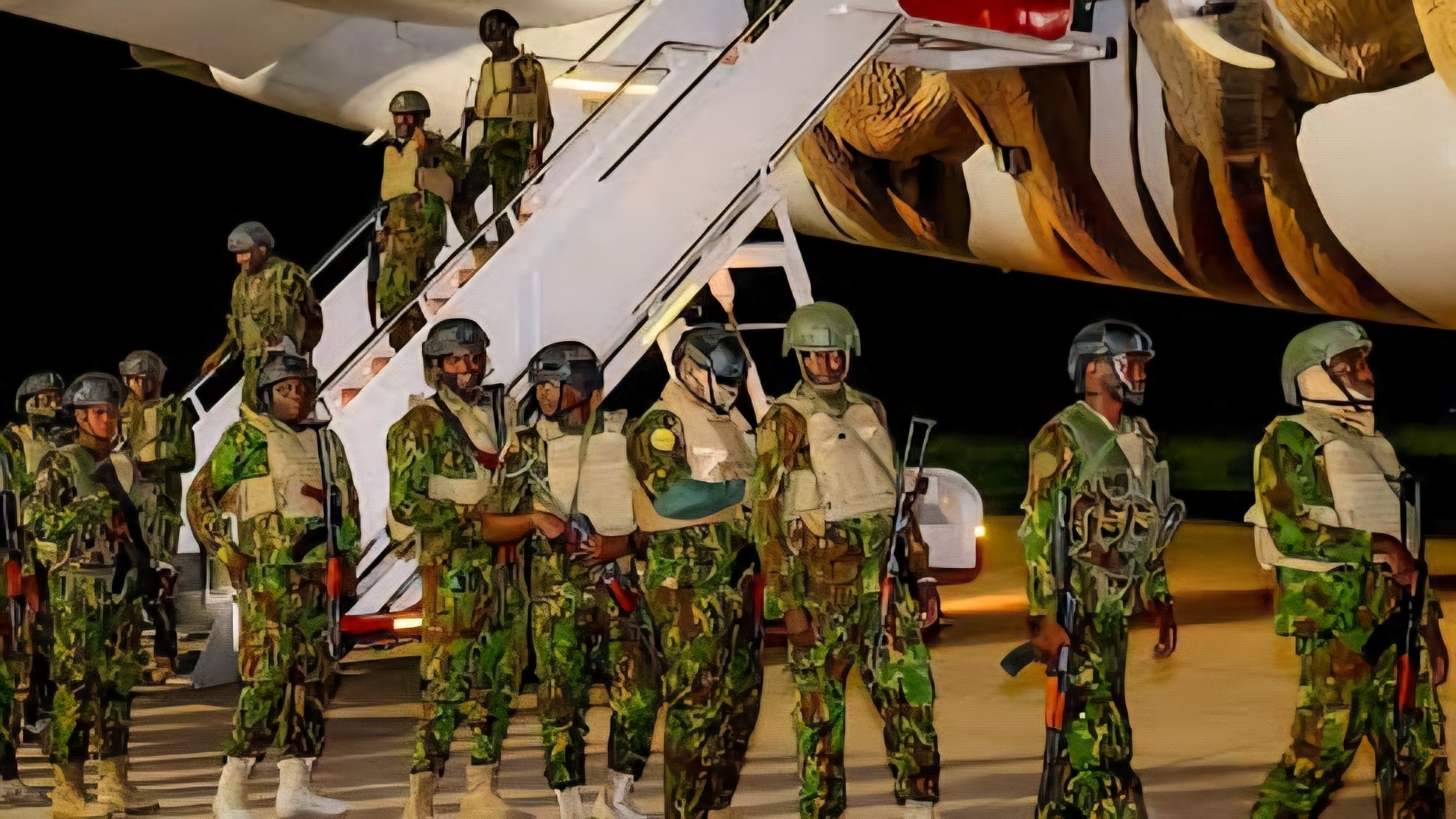 Kenyan police officers in camouflage uniforms and tactical gear disembarking from a Kenya Airways aircraft onto an airport tarmac.