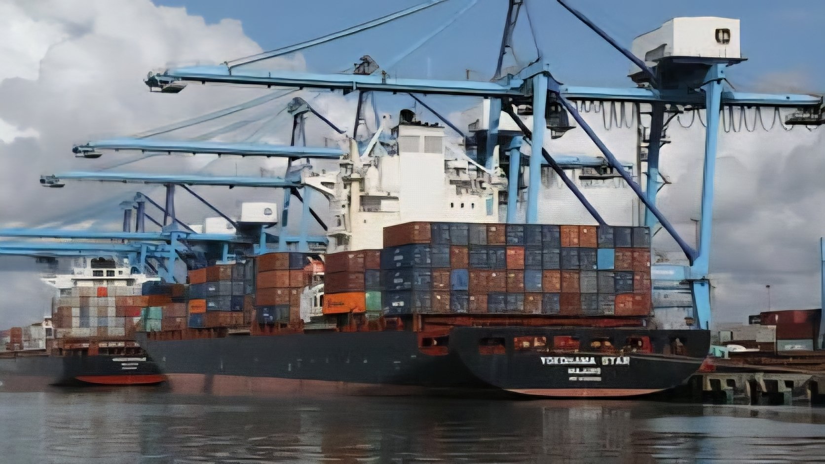 The Yokohama Star cargo ship docked at the Port of Mombasa under blue gantry cranes during a period of global shipping disruptions.
