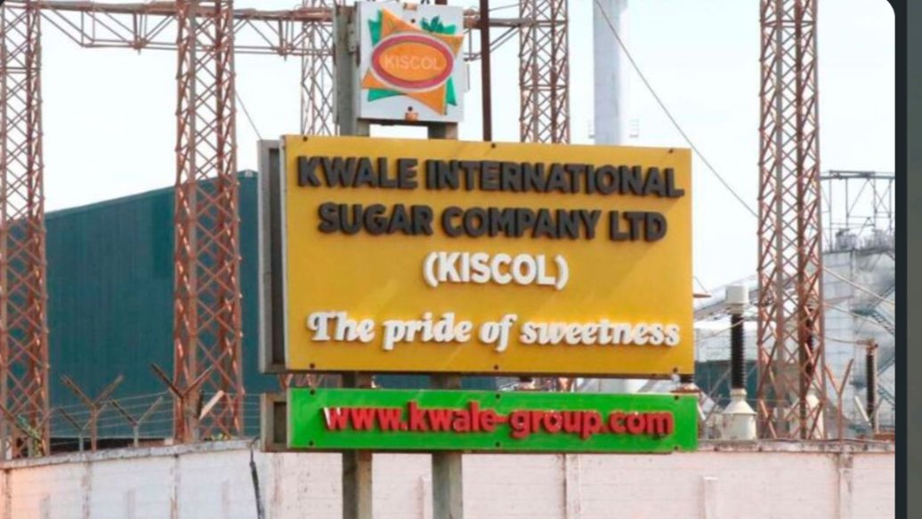 Entrance sign for Kwale International Sugar Company Ltd along a road in Kwale County, Kenya.