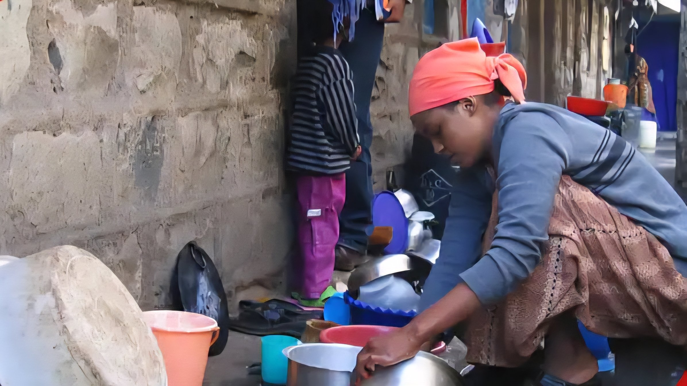 File 240060.png shows a close-up view of a domestic worker washing household utensils in an outdoor residential area in Kenya.