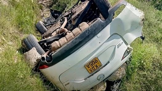 Overturned white Mazda CX-5 vehicle at the scene of an accident on the Chemelil-Miwani-Kisumu Road