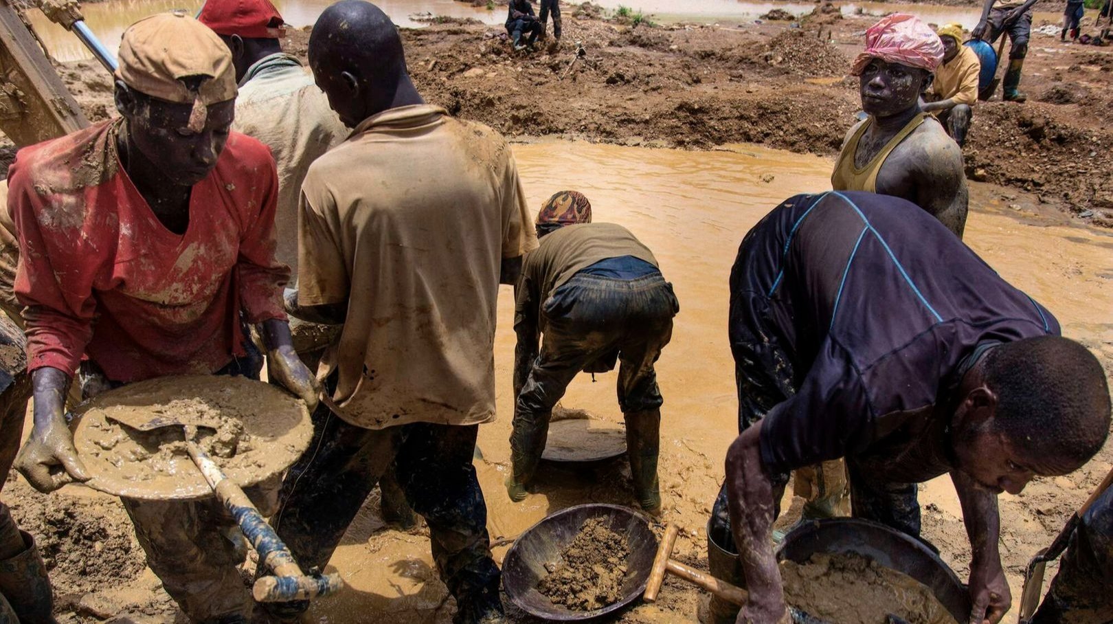 Workers processing minerals at a mining facility in Africa.