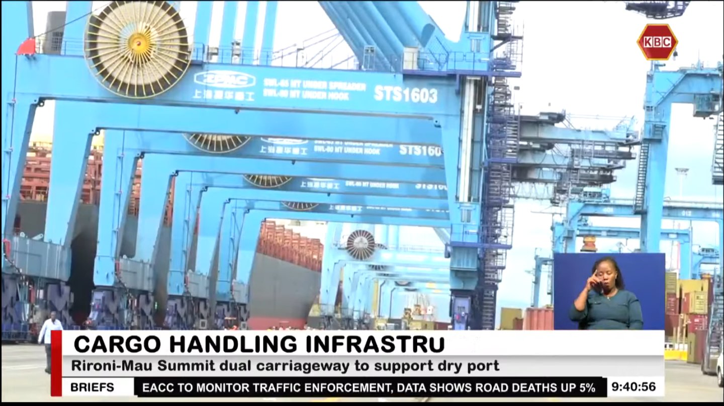 The Mai Mahiu large inland container depot connected to a railway line running alongside a major highway intersection in a semi-arid landscape.