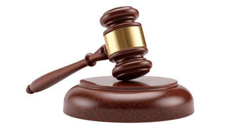 A gavel resting on a wooden desk next to legal documents in a Kenyan courtroom setting.