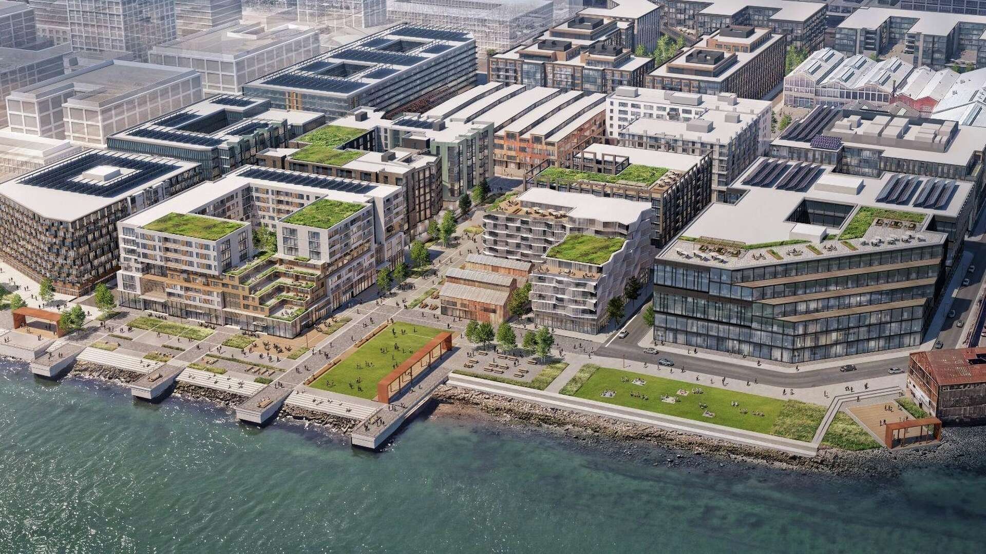 Aerial rendering of the proposed Pier 70 mixed-use waterfront redevelopment in San Francisco, featuring multi-story residential buildings with green roofs.