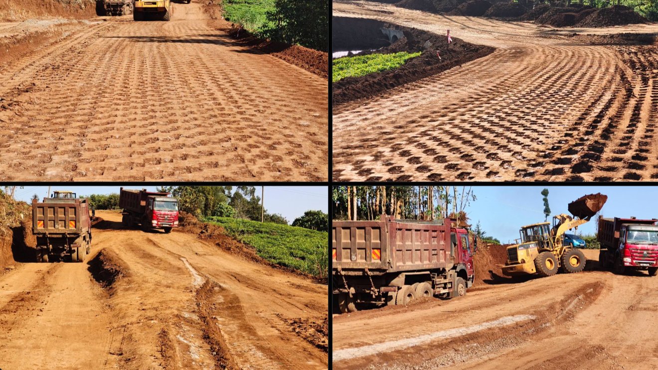 Heavy earthmoving machinery and tipper trucks performing earthworks on the Kiamaina-Gathuthuma-Kianjagi Road construction site.