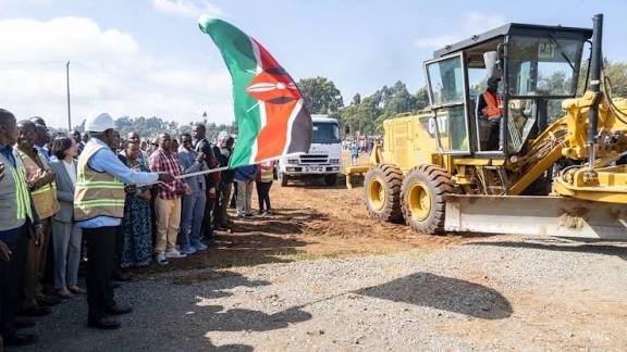 Heavy earthmoving machinery and engineers at the Rironi-Mau Summit highway construction launch site in Kiambu County.