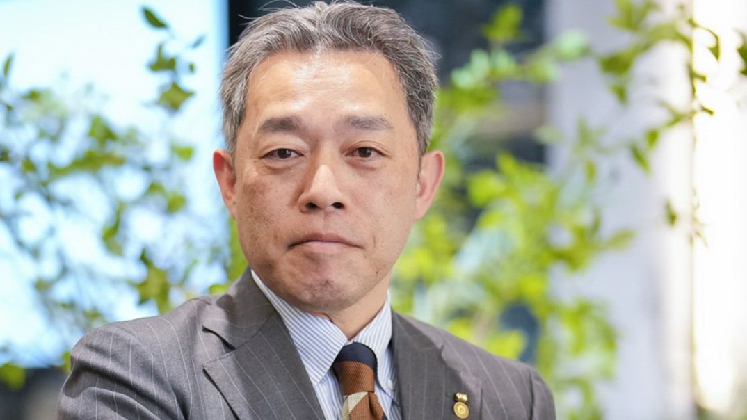 Headshot of APA Group Chief Executive Officer Isshi Motoya looking toward the camera at an event, referenced as 232969.jpg.