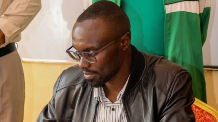 A government official reviews documentation during a site inspection of water infrastructure projects, as displayed in the image 276010.png.