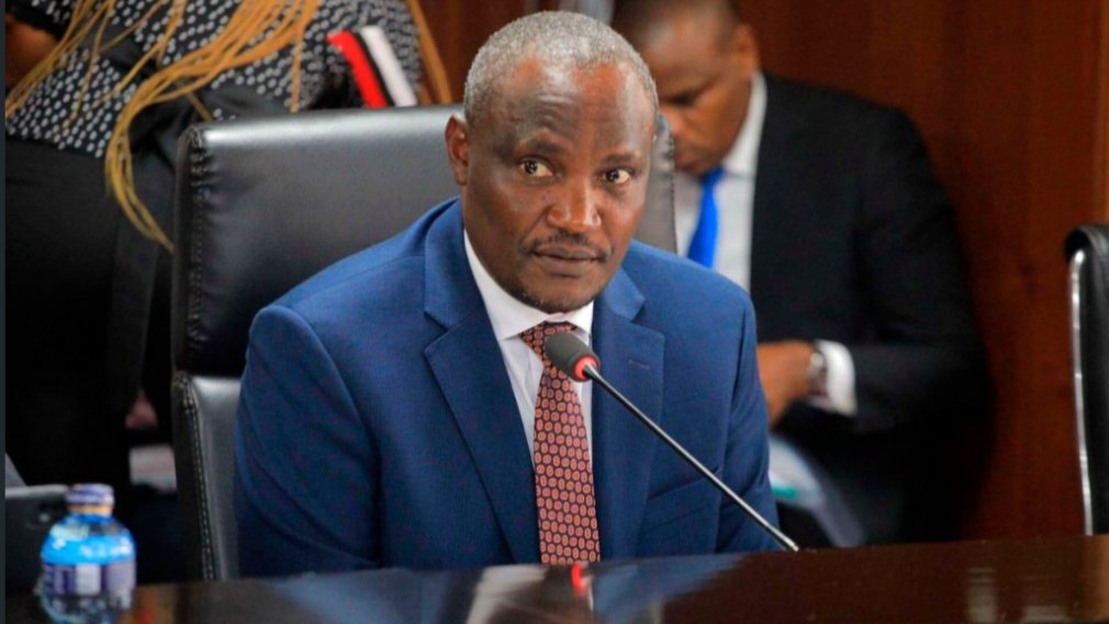 Treasury official listening during a parliamentary committee meeting in Nairobi.