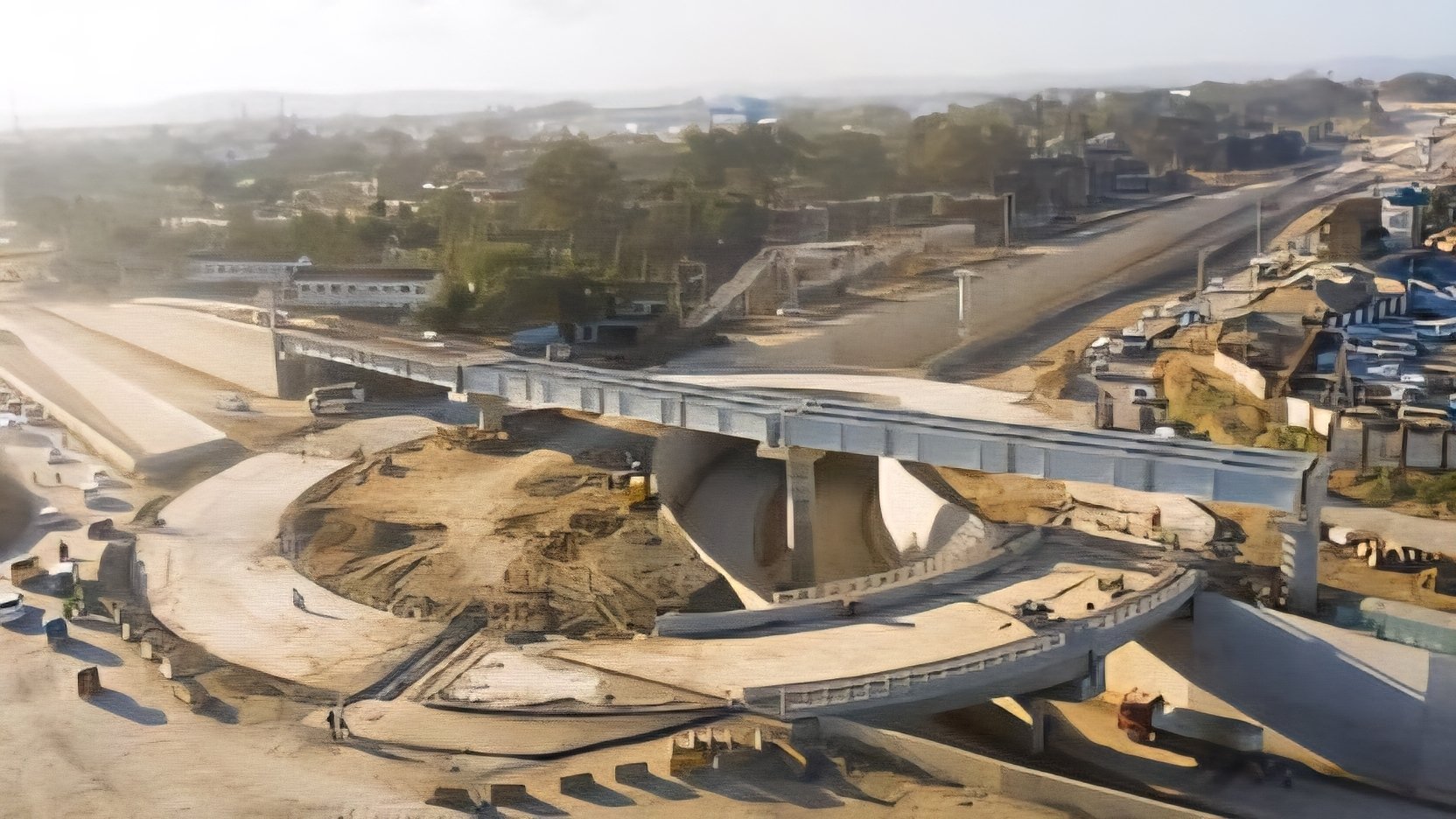 KeNHA road construction equipment working on a highway upgrade project in Kenya.