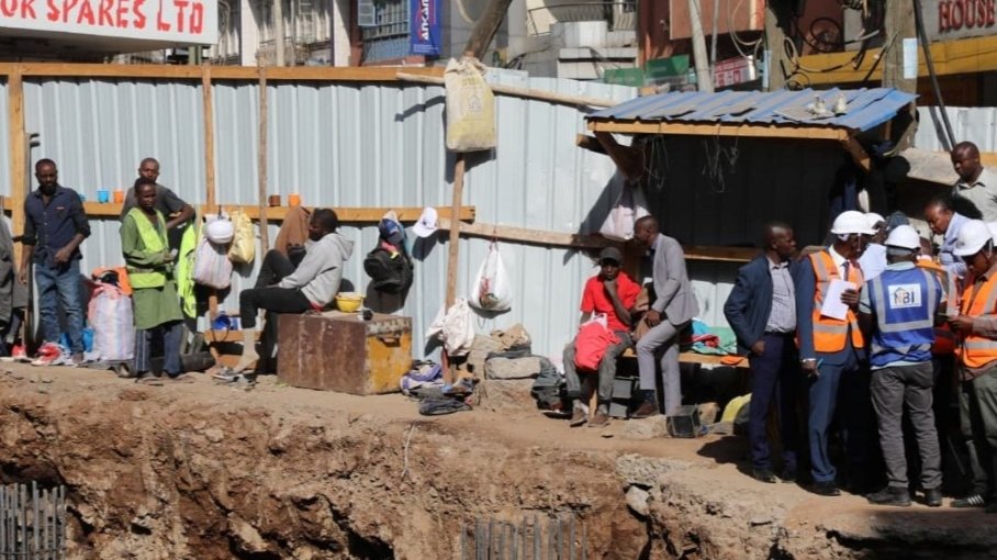 Debris from collapsed wall at construction site near OTC along Kirinyaga Road, Nairobi, with rescue teams and police tape visible