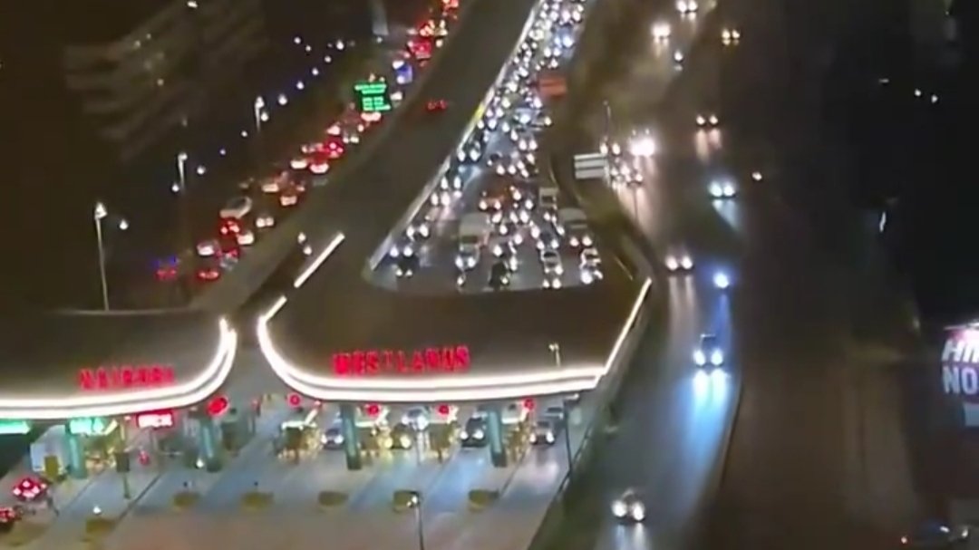 Aerial night view of heavy traffic queued at a Nairobi Expressway toll point near Westlands.