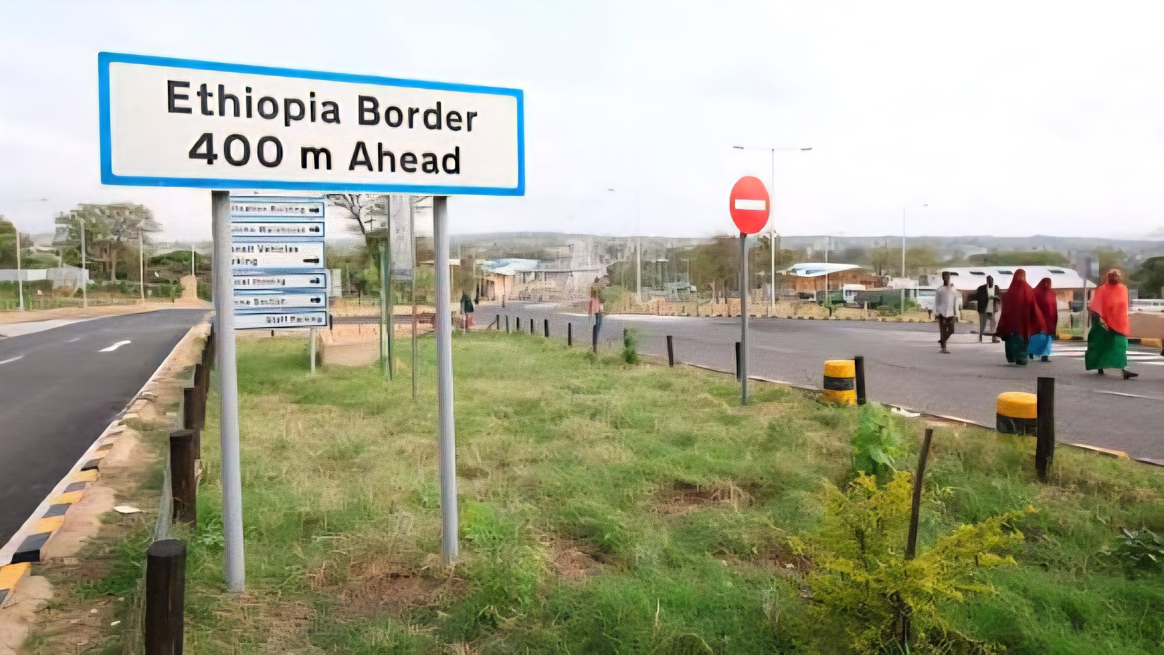 A road leading toward the Ethiopia border with a sign reading Ethiopia Border 400 m Ahead, illustrating the porous nature of East African transit points.