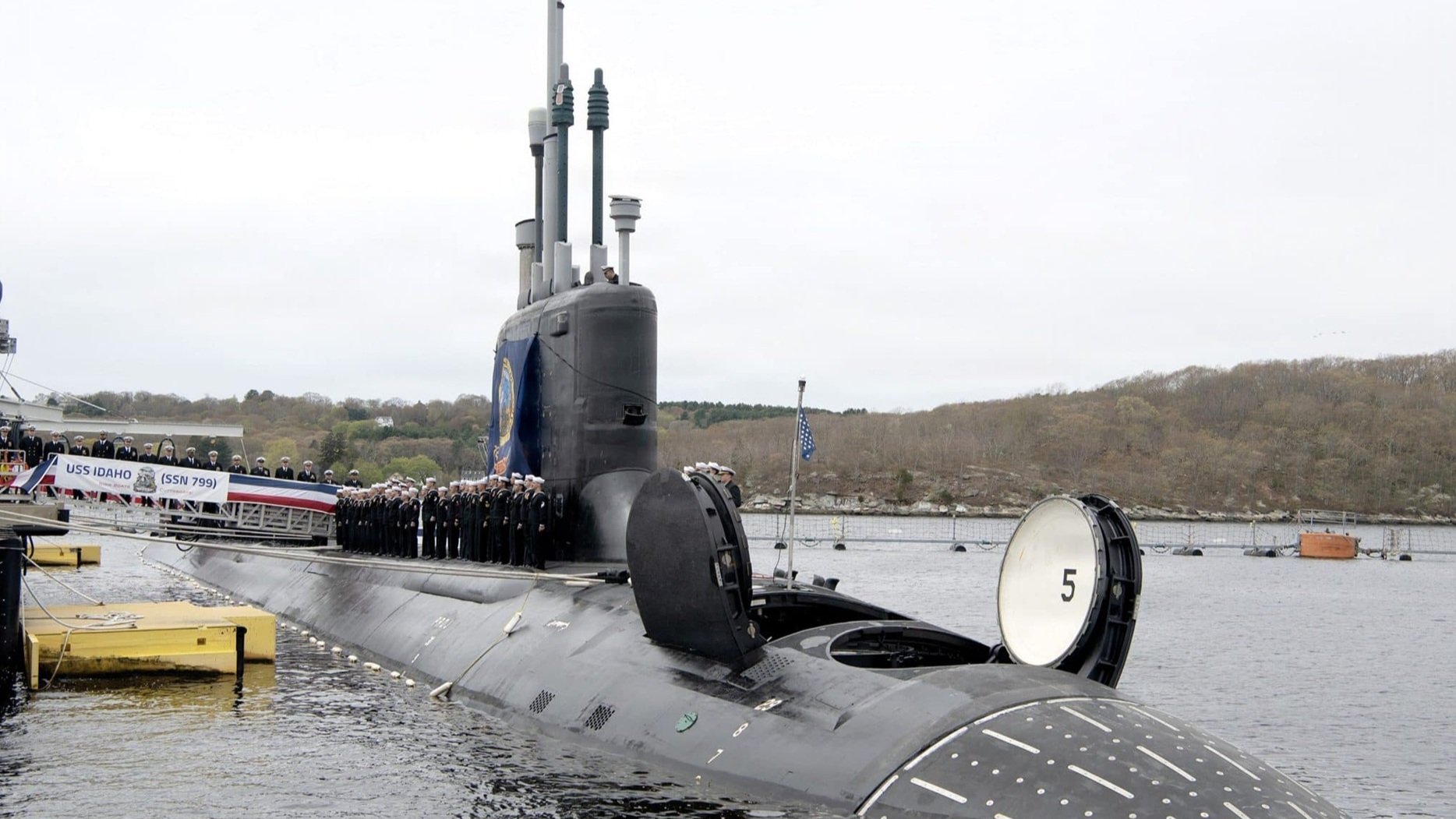 USS Idaho (SSN 799) Virginia-class submarine with sailors lining the deck during its commissioning ceremony at Naval Submarine Base New London.