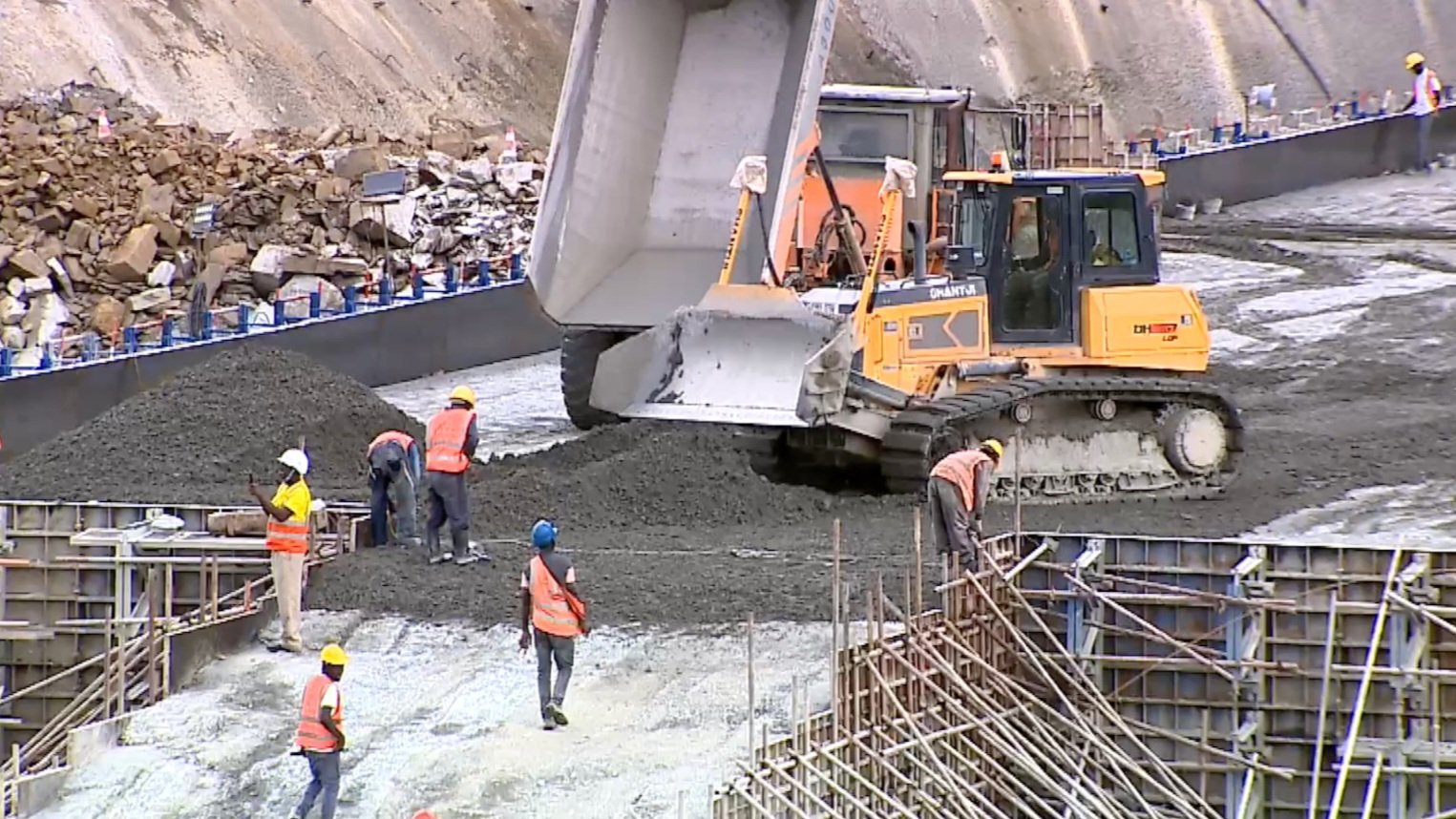 A wide aerial view of an existing large-scale irrigation scheme in Kenya with water distribution channels and green agricultural plots.