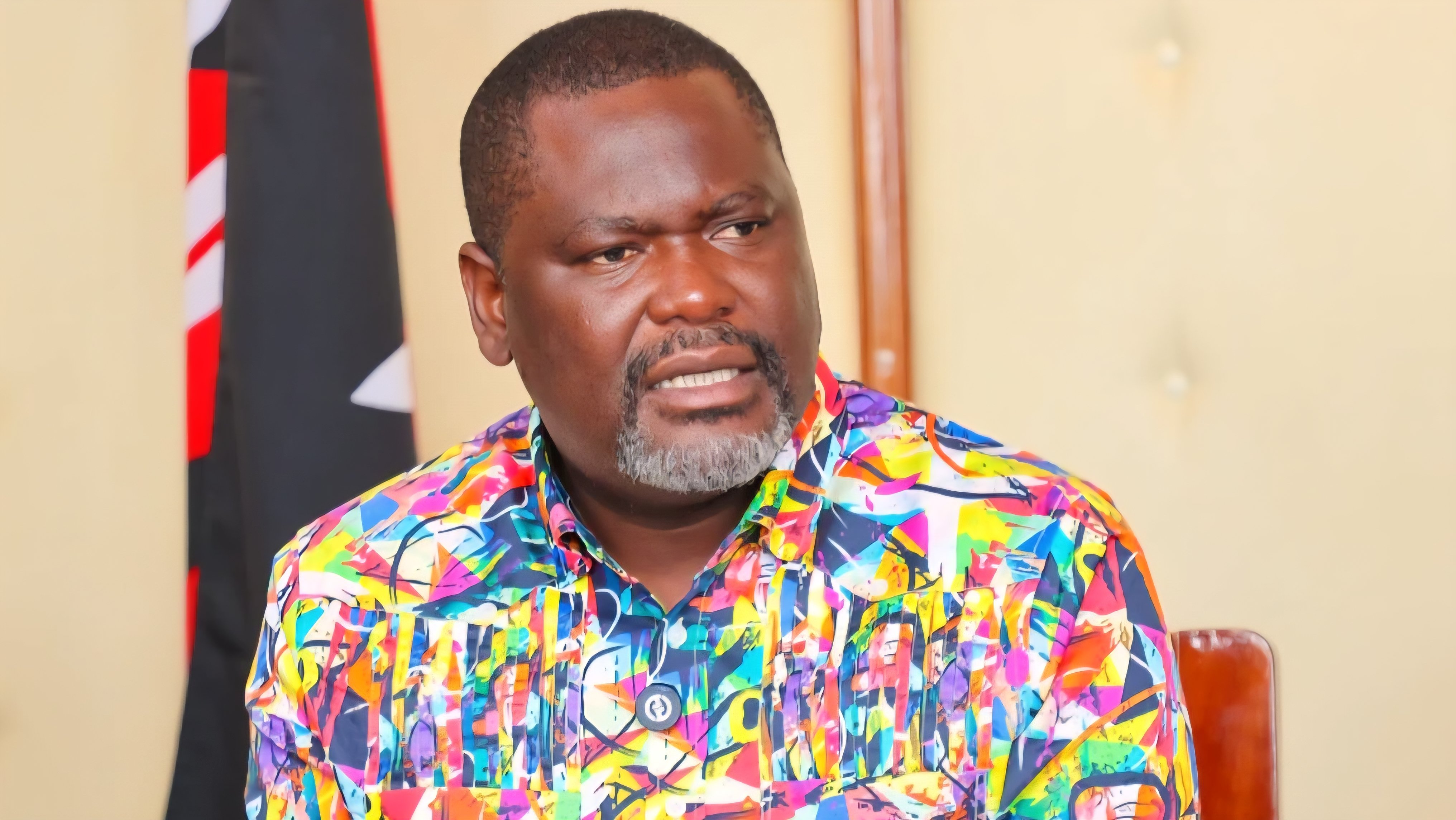 Cabinet Secretary Justin Ruku speaking at a podium during a public event in Machakos County.