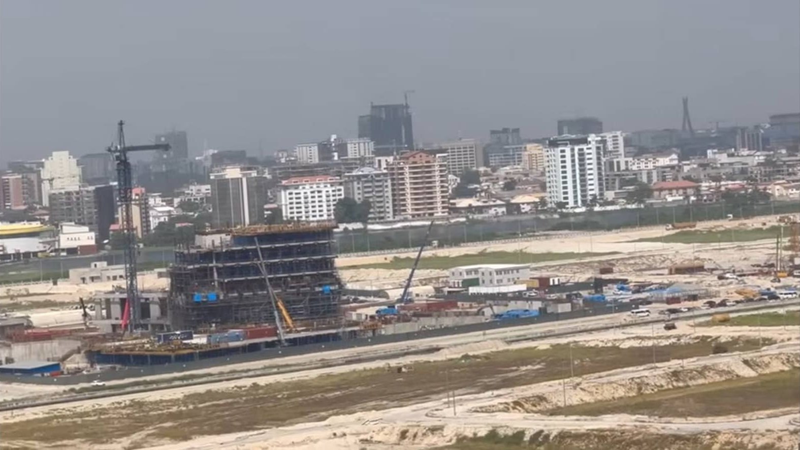 Construction site of the U.S. consulate building showing cranes and concrete structures at Eko Atlantic City in Lagos.