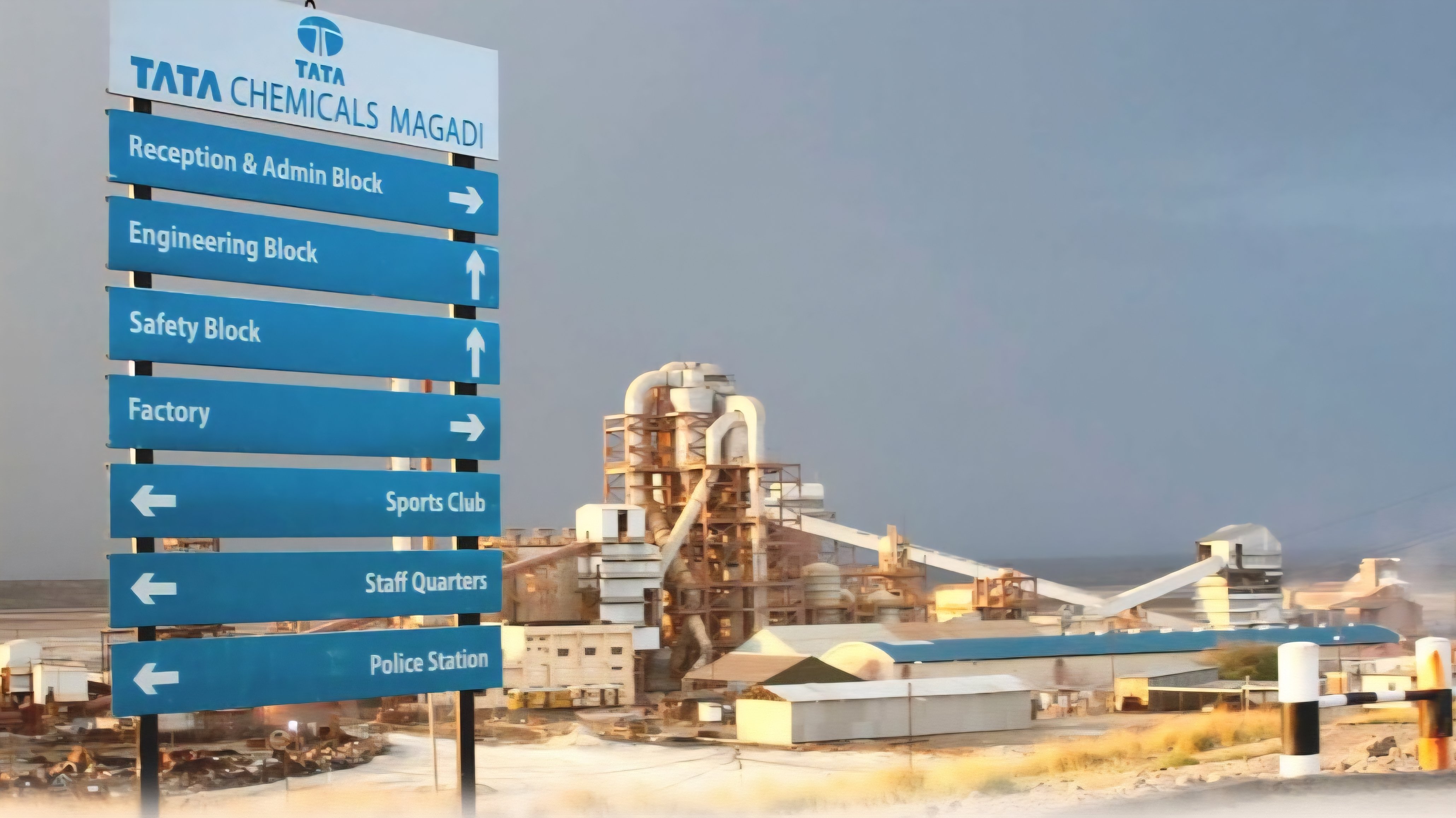 Entrance signage and processing facilities at the Tata Chemicals Magadi plant in Kajiado County, Kenya.