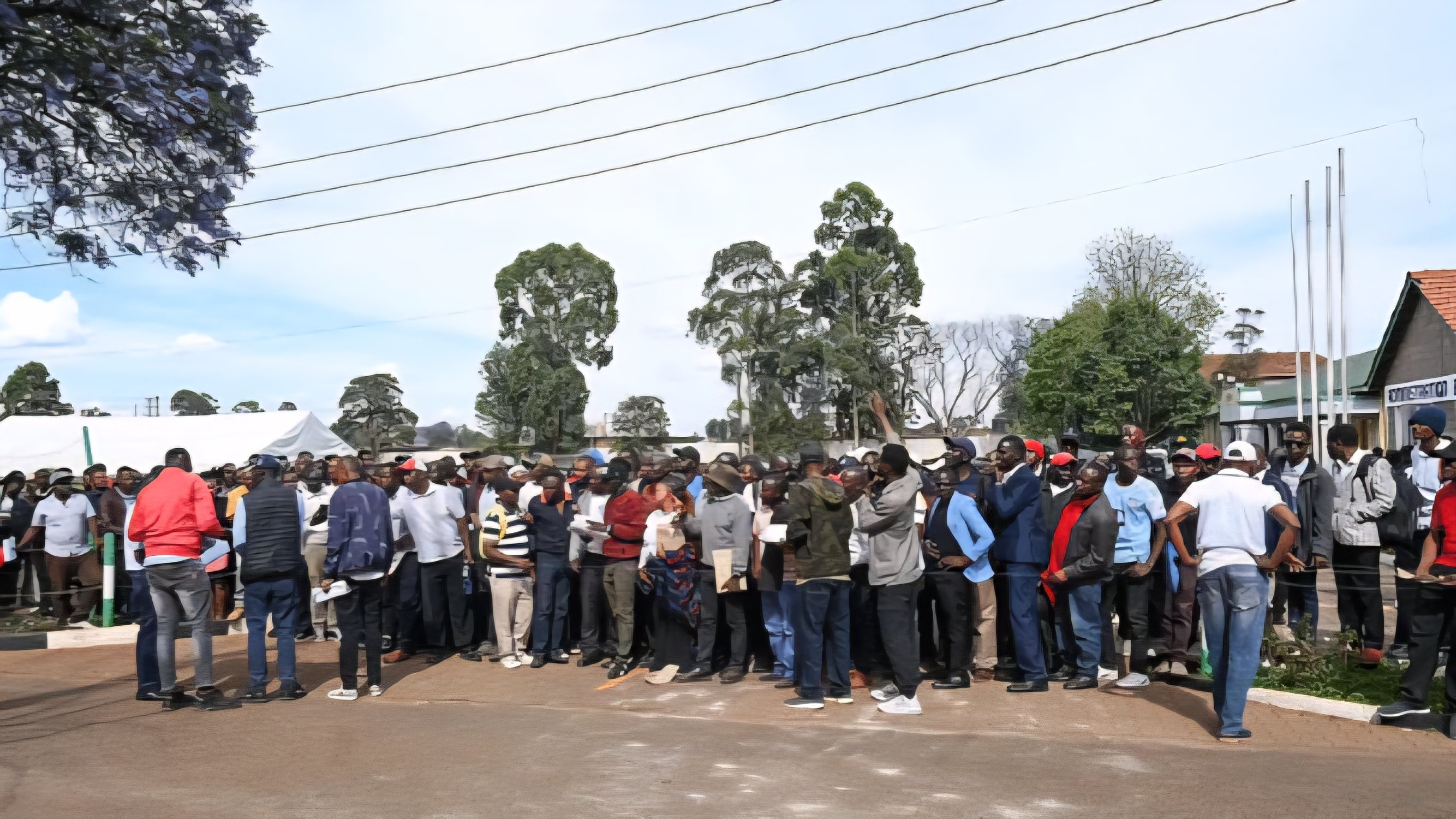 Job applicants and members of the public gathered outside a public institution building during a hiring exercise in Kenya.