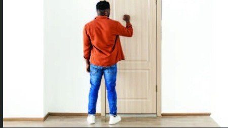 Person knocking on a neighbor's door to discuss a dispute.