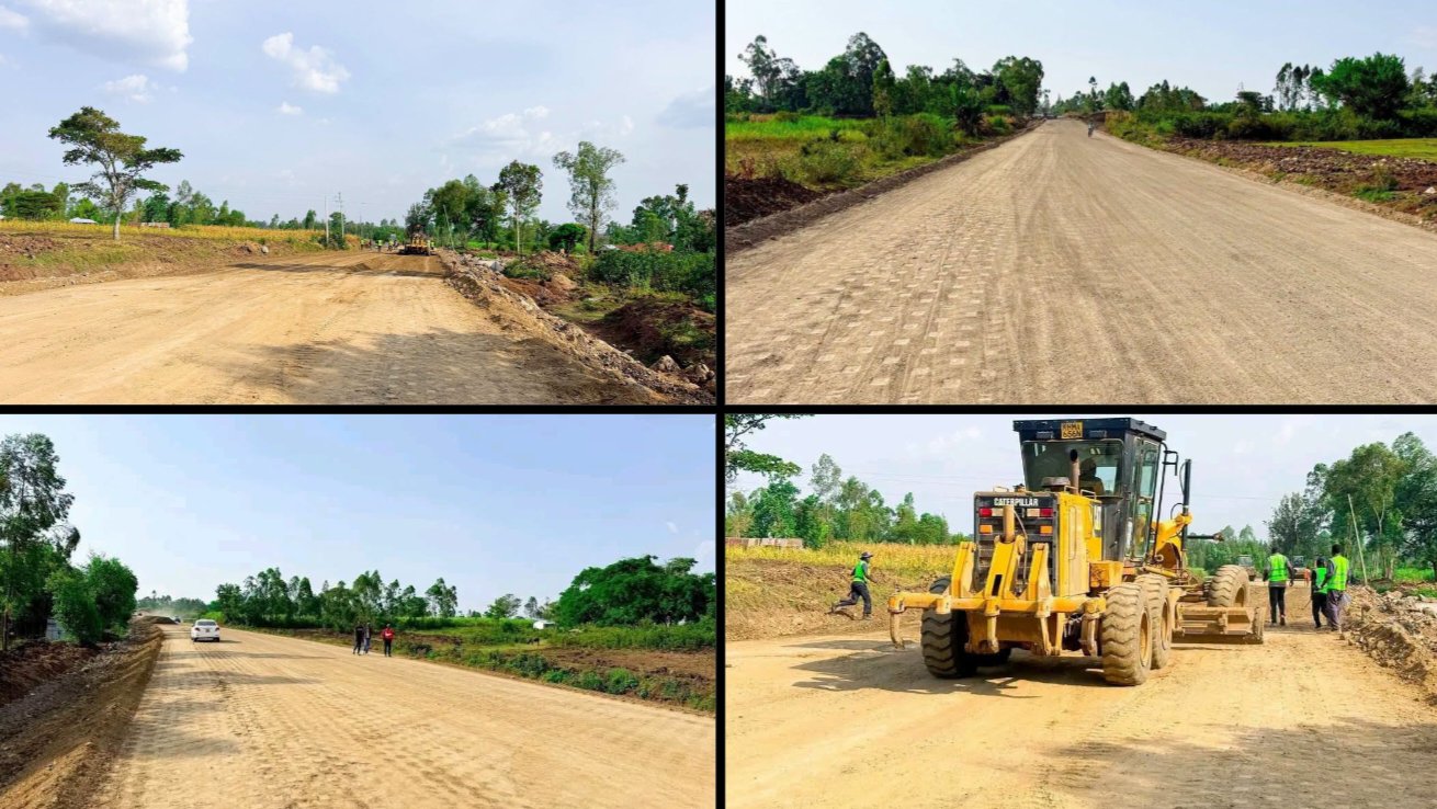 A yellow motor grader smoothing and leveling an unpaved road during construction works on Gor Mahia Road in Ndhiwa.