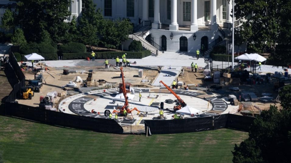Construction workers use a jackhammer on the White House helipad on the South Lawn, Washington, D.C.