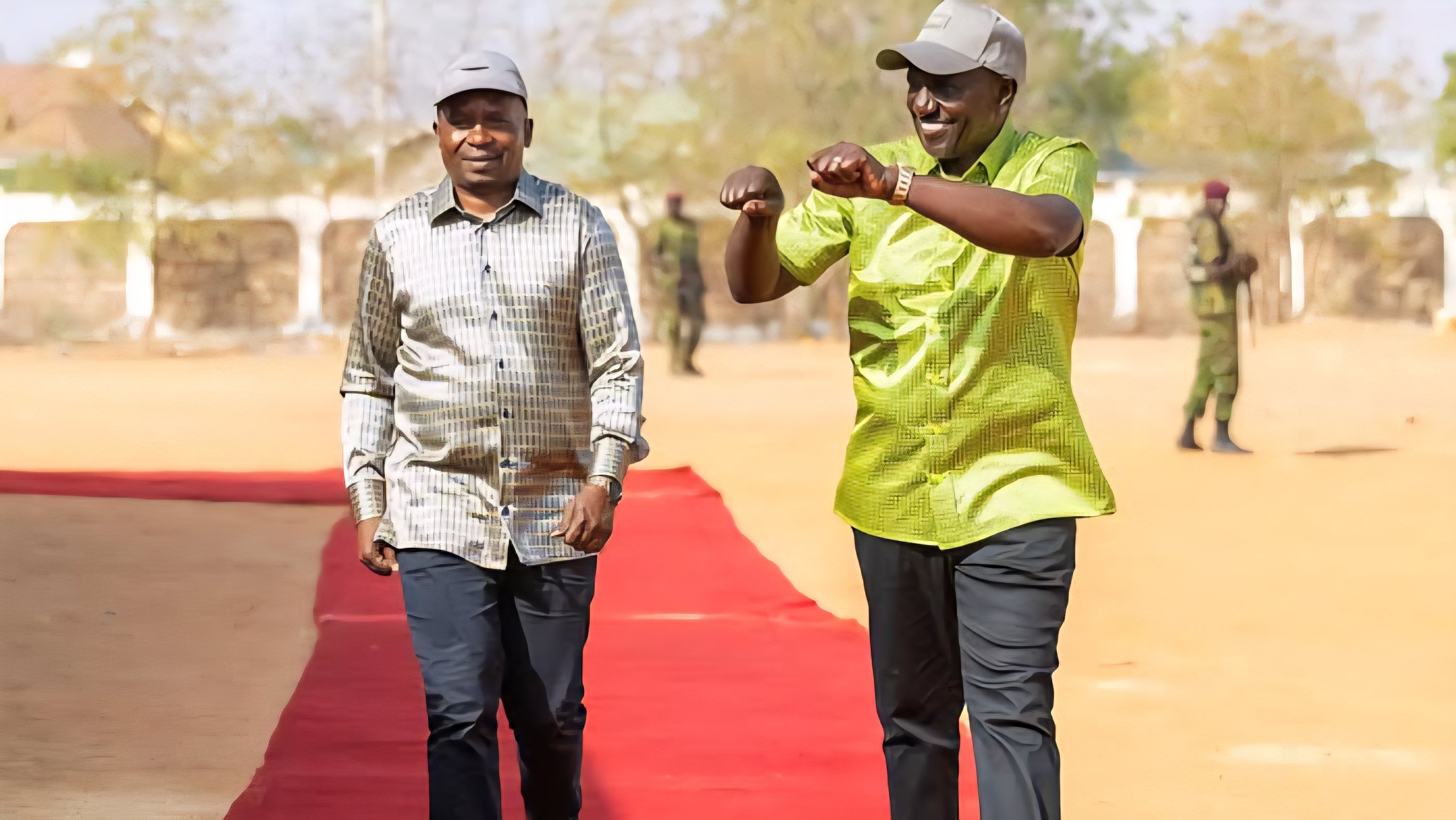 President William Ruto and officials walking on a red carpet at Mandera Stadium.