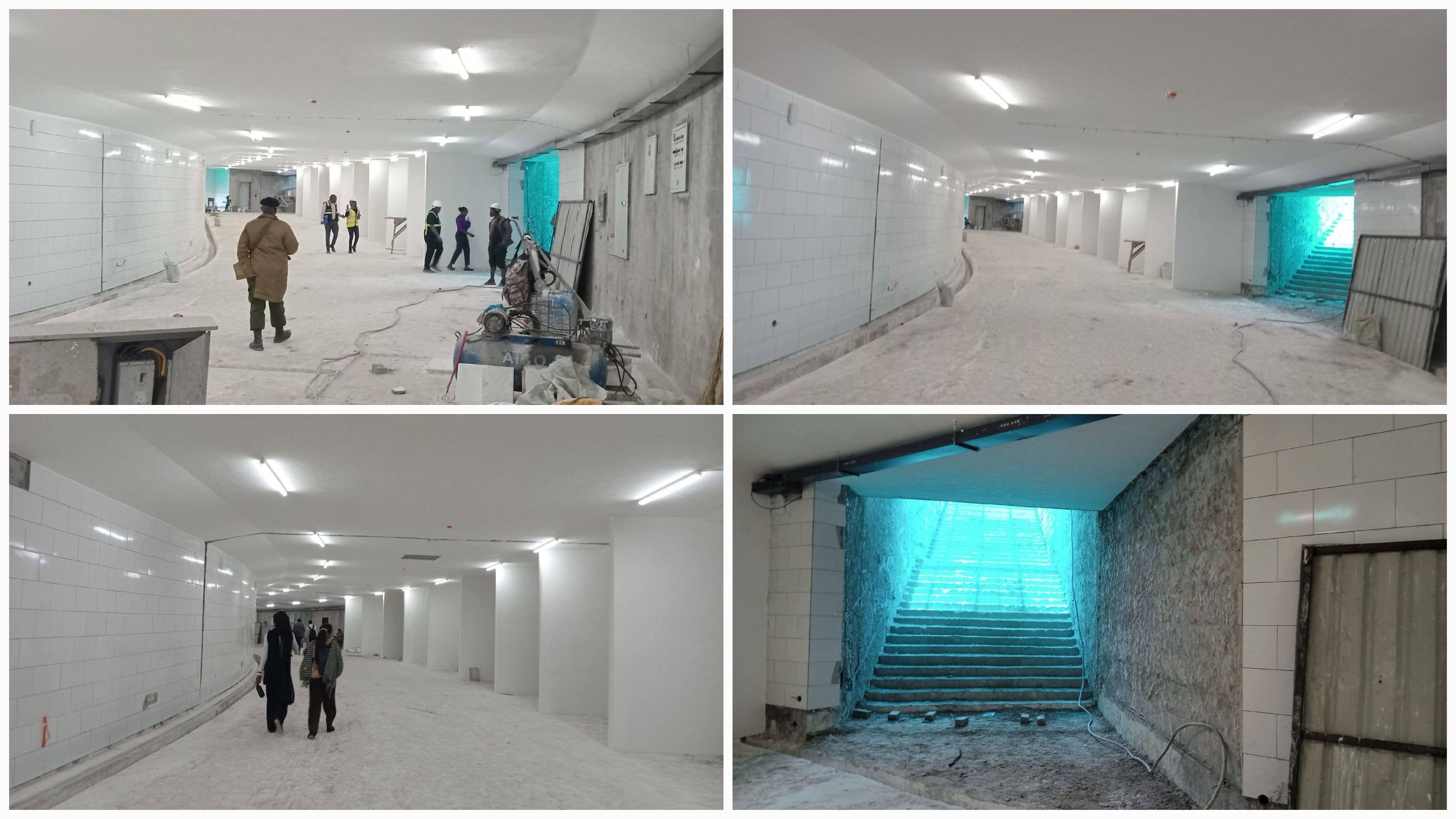 Construction workers on the Haile Selassie Underpass site in Nairobi, showing the newly installed white-tiled interior of one of the pedestrian tunnels.