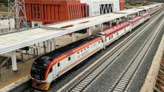 A Standard Gauge Railway line stretching across an open landscape in East Africa during ongoing regional railway expansion efforts