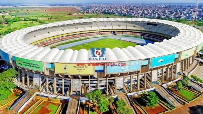 An aerial view of the Moi International Sports Centre, Kasarani, showing ongoing renovation work on the pitch and seating areas under a clear sky.