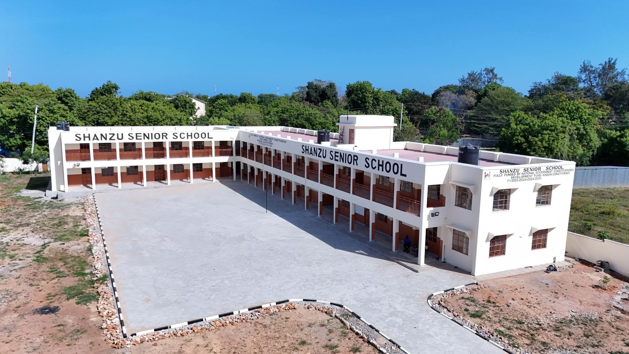 A photo collage of the newly completed Shanzu Senior School in Mombasa, showing the eight-classroom block and the administration building.